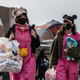 Women wearing face masks leave Tokyo Disneyland on February 28, 2020.